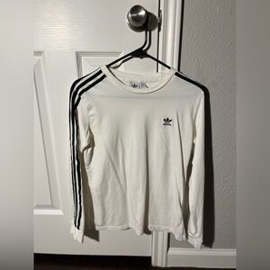 White adidas, black striped long sleeves.